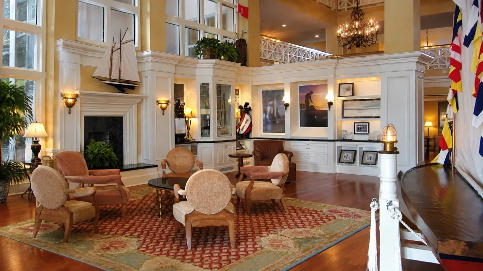 Custom painted cabinetry, built-ins, fireplace surround, and display millwork in a finished hospitality interior.