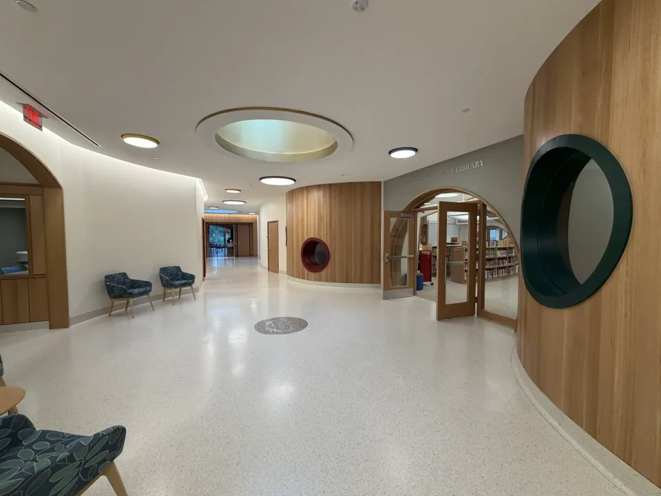 CKC custom architectural woodwork in a bright library interior.