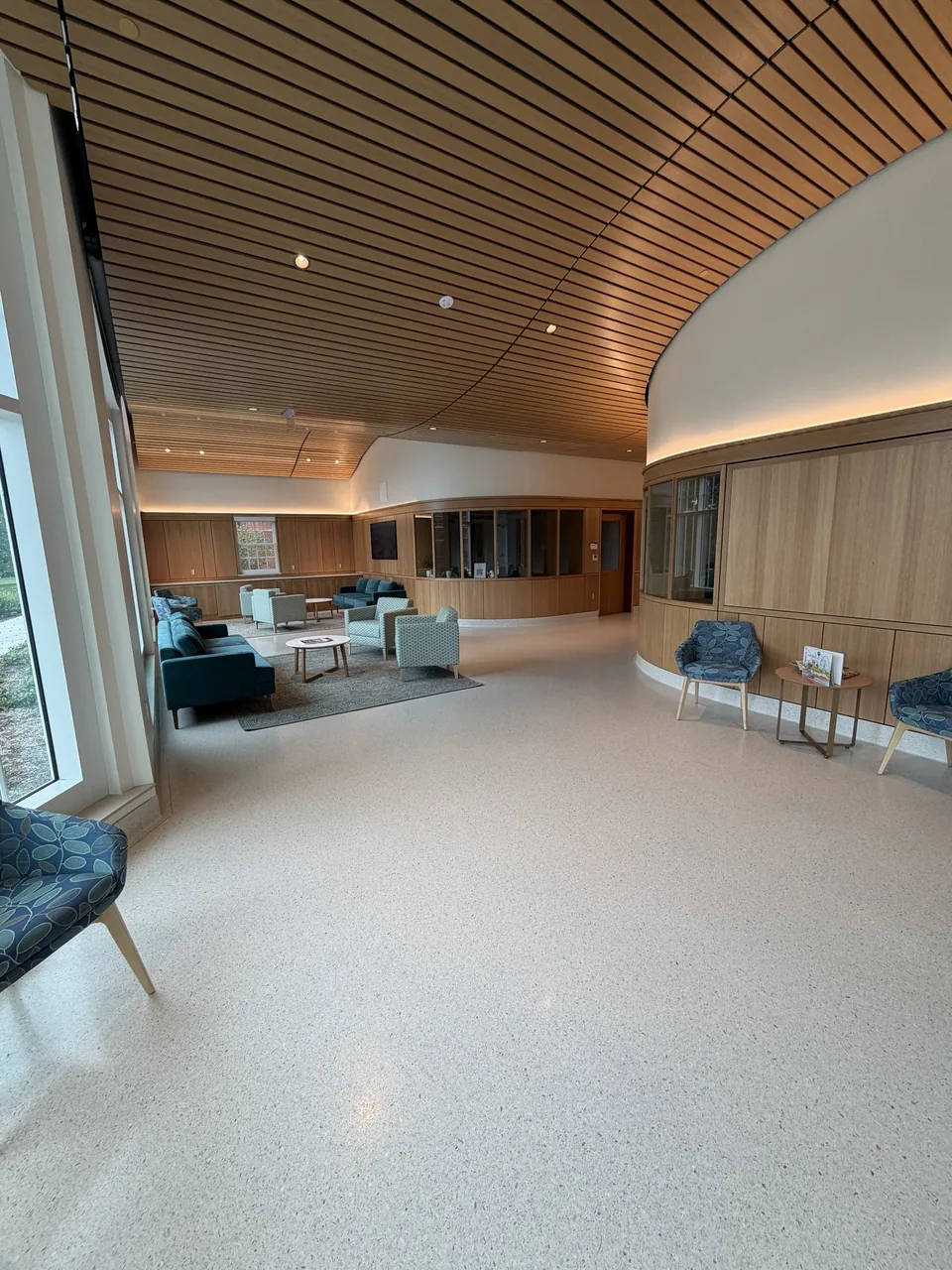 CKC custom wall paneling and wood ceiling in an education lounge.