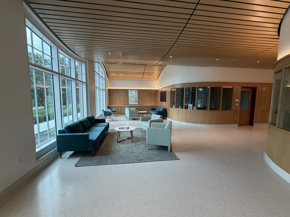 Custom wall panels and wood ceiling in a gathering space.