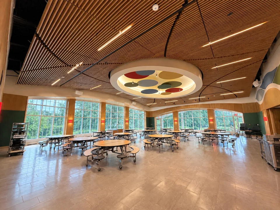 CKC wood ceiling and wall millwork in an education commons.