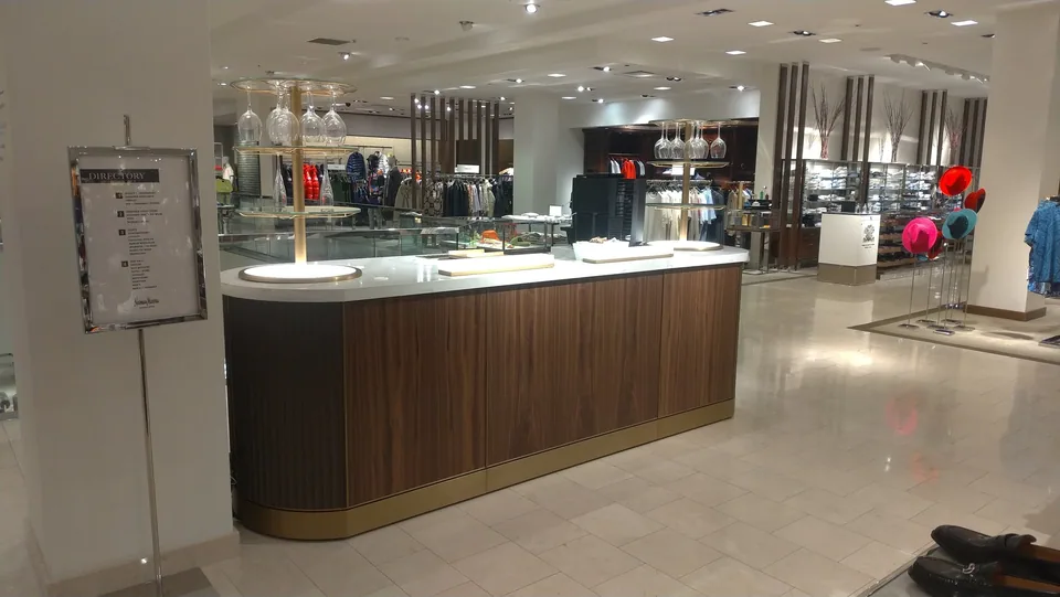 CKC custom commercial fixture with curved wood detailing.